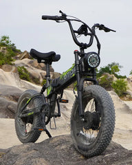 OTIDA R7 MAX Dual Motor Electric Bike with large wheels on a rocky outdoor background