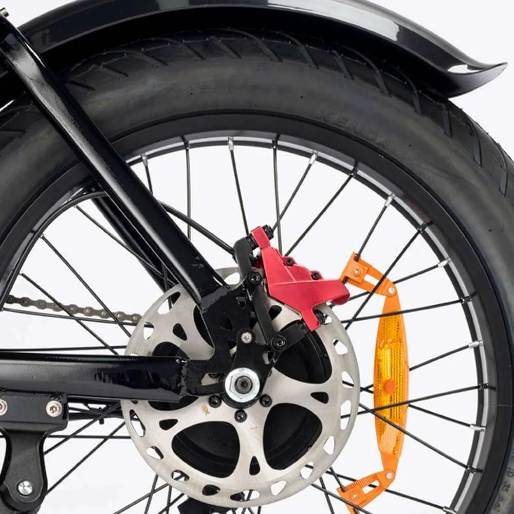 Close-up of wheel with disc brake and orange reflector on a white background - Ridstar Q20 Pro Electric Cargo Bike